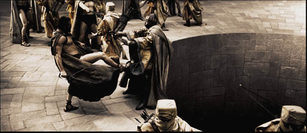 Leonidas (GERARD BUTLER) personally delivers his answer to the Persian Messenger (PETER MENSAH) in Warner Bros. Pictures, Legendary Pictures and Virtual Studios action drama 300, distributed by Warner Bros. Pictures. PHOTOGRAPHS TO BE USED SOLELY FOR ADVERTISING, PROMOTION, PUBLICITY OR REVIEWS OF THIS SPECIFIC MOTION PICTURE AND TO REMAIN THE PROPERTY OF THE STUDIO. NOT FOR SALE OR REDISTRIBUTION